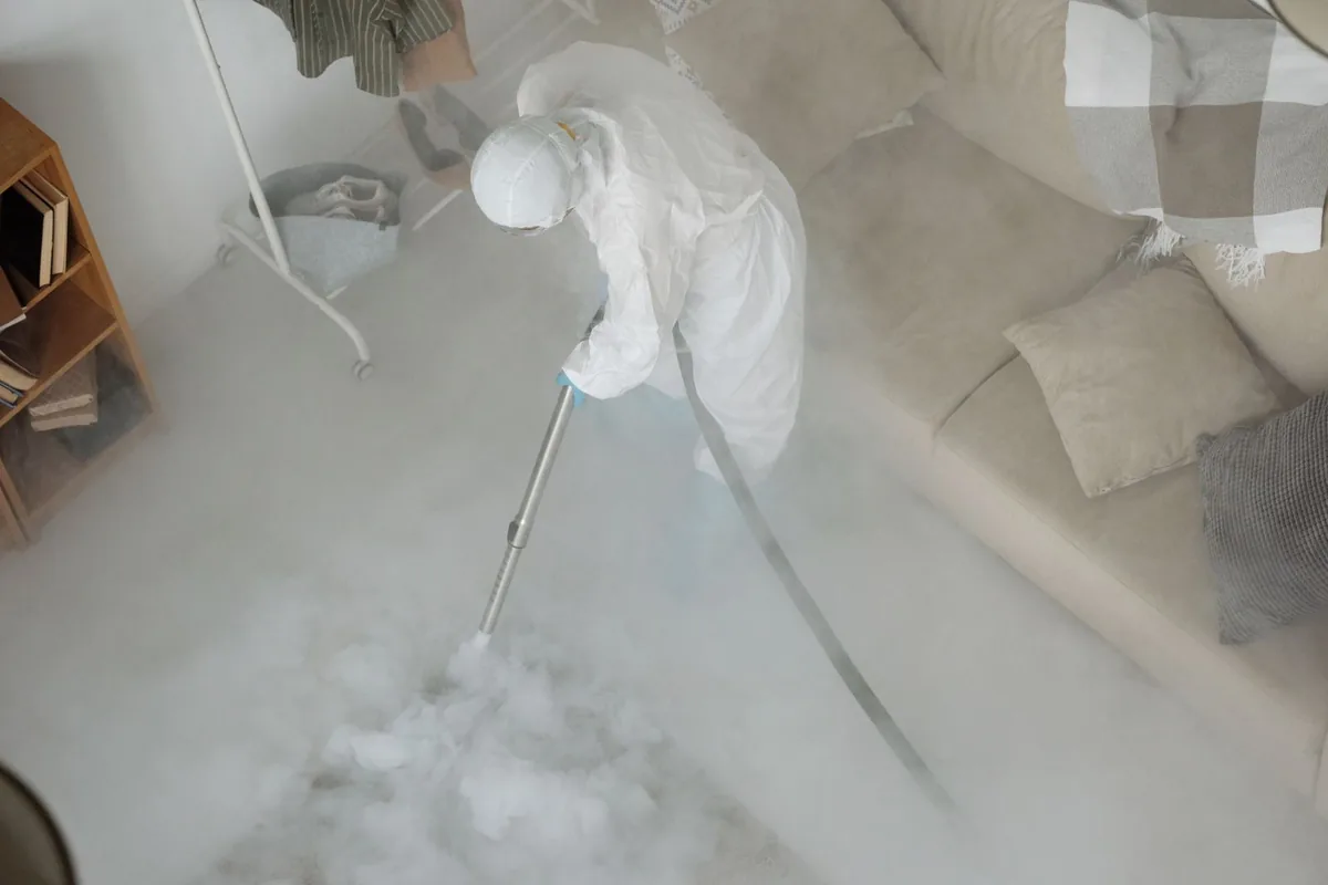 Biohazard cleanup technician in protective equipment, Pipestone, MN
